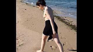 getting naked on the beach flashing snatch in doggy style